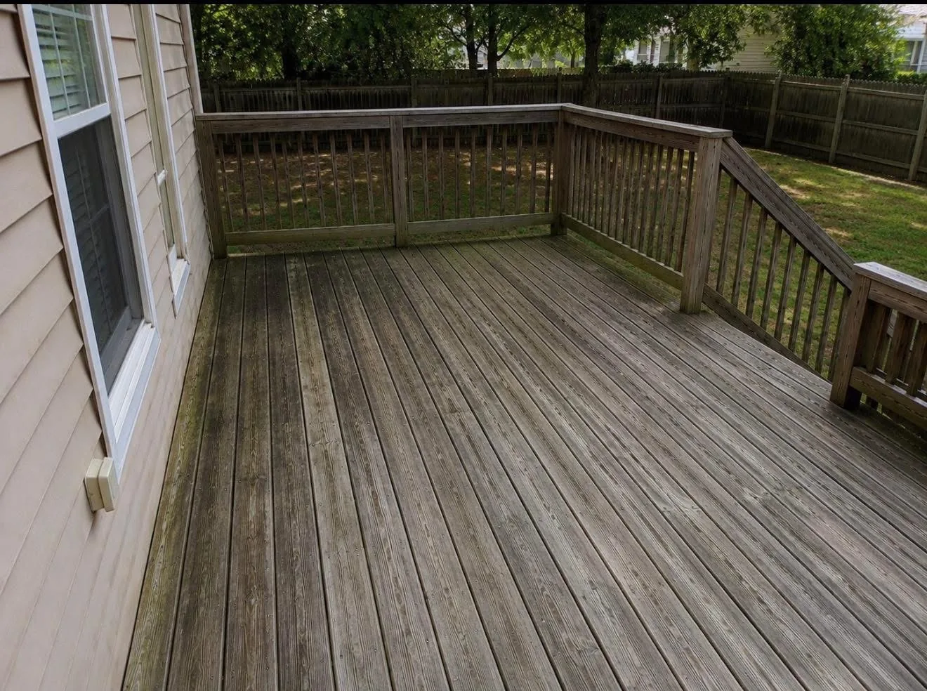 Weathered wood deck before professional cleaning