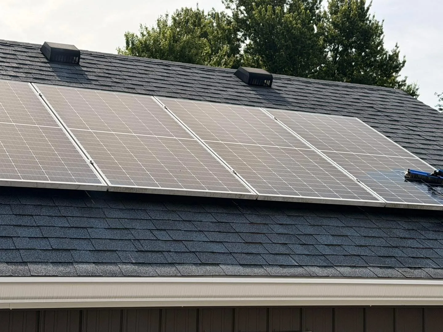 Residential solar panels with visible surface buildup